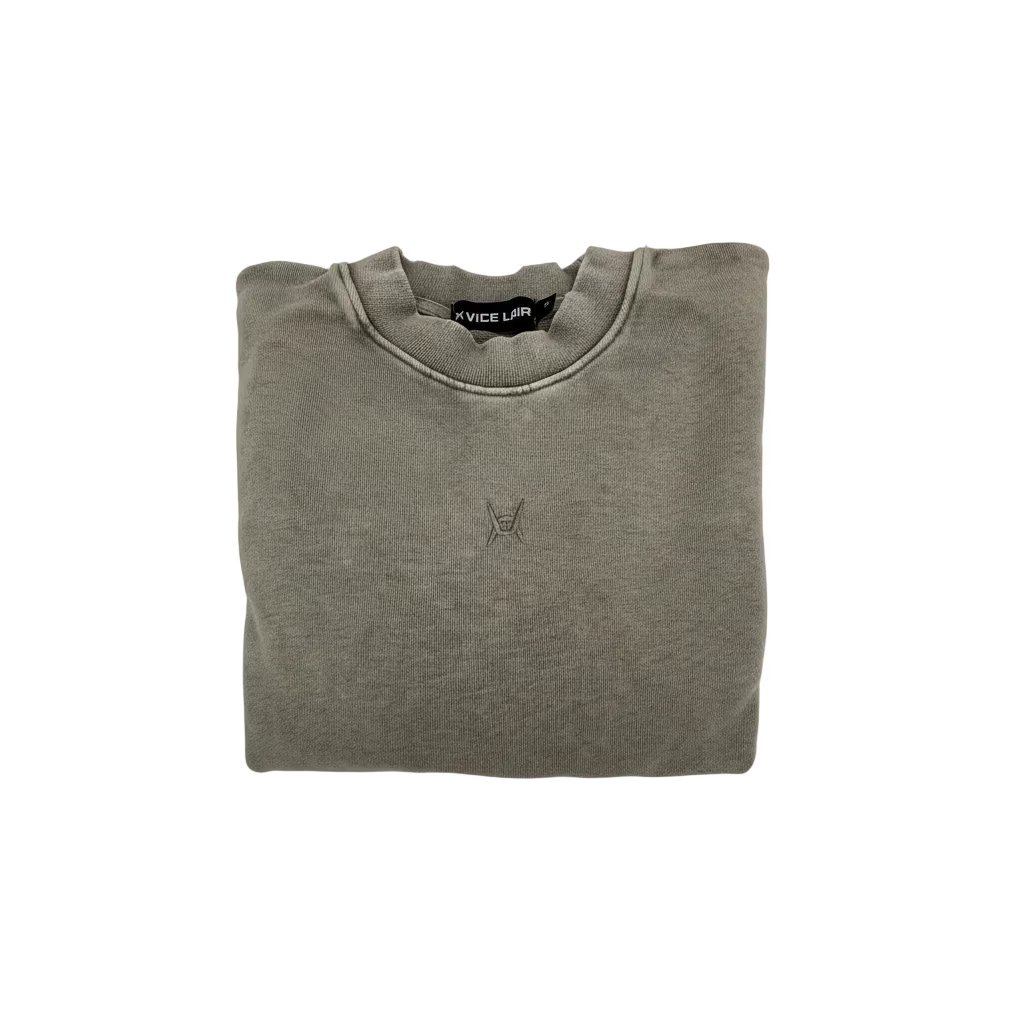 Folded gray sweatshirt with a small logo on a white background